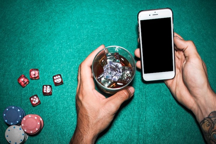 Player hand holding mobile device with game spinning
